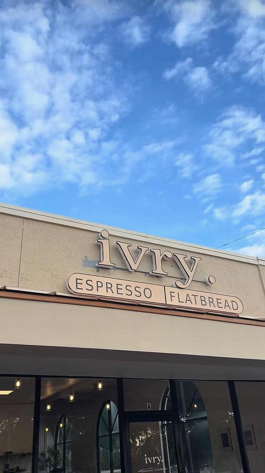 The ivry. storefront sign — 'ivry. Espresso · Flatbread' — against a blue South Tampa sky.